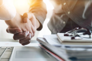 two men shaking hands